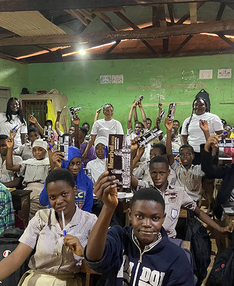 Some students showing their math a they've received from the Growth Mindset Development Foundation